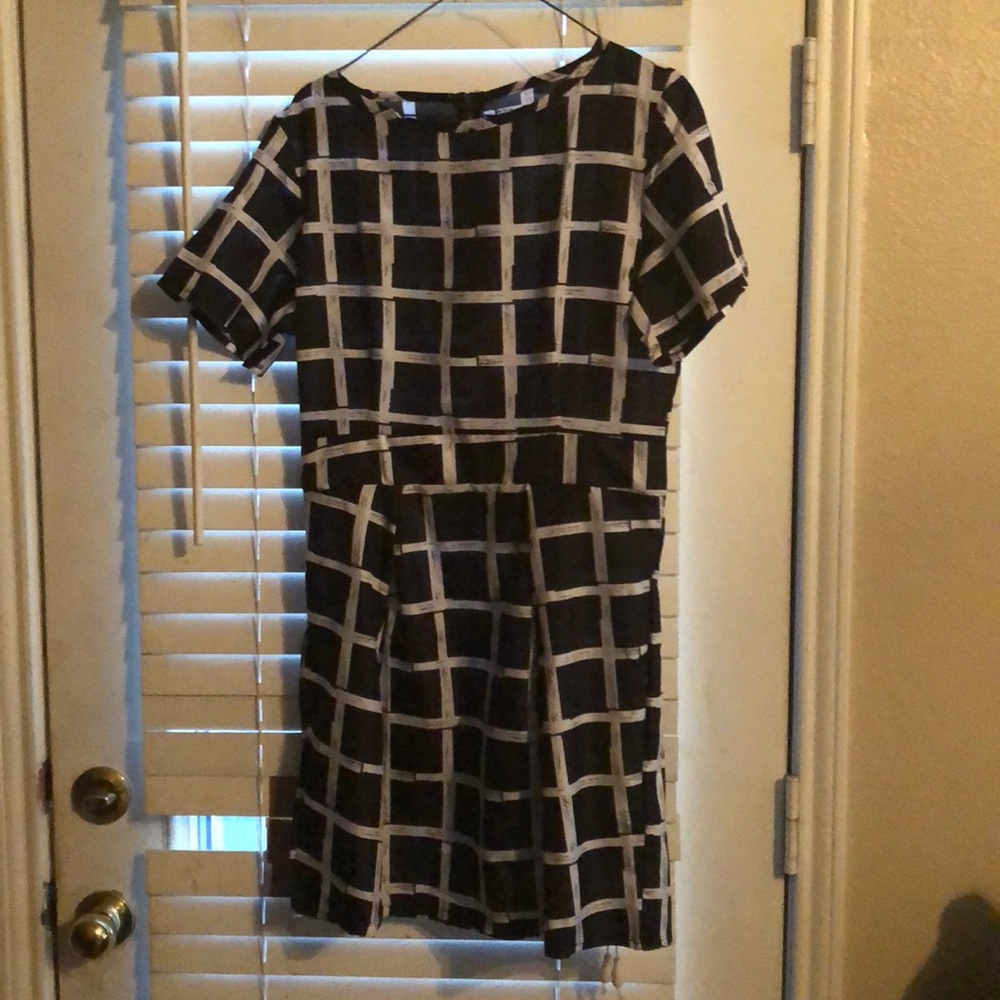 Mid thigh black and white silk dress.
